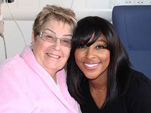 Cardiac arrest survivor Judith Mansfield with Alexandra Burke