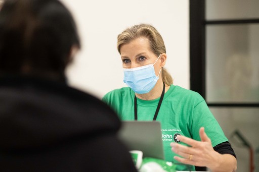 The Countess of Wessex greets a patient whilst volunteering with St John