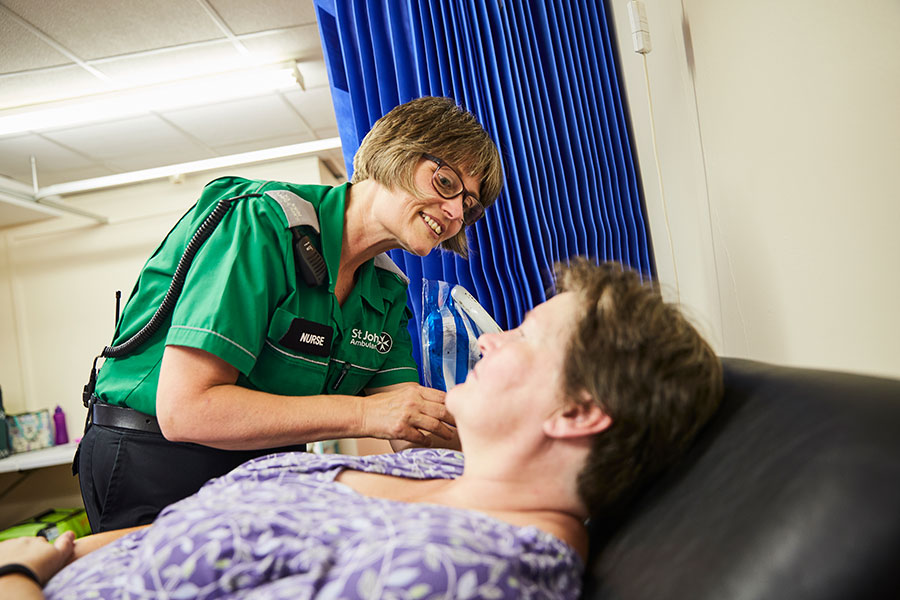 Healthcare professional volunteer helping a patient