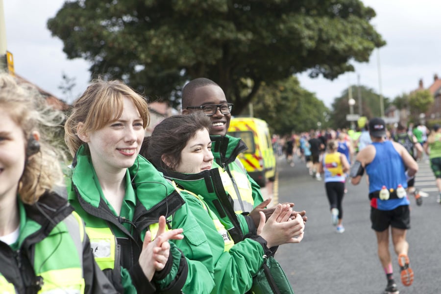 Volunteers support runners at event