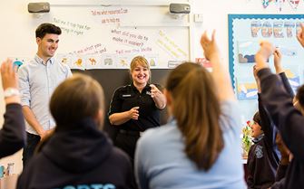 Teaching first aid to a class of school pupils Teaching first aid to a class of school pupils