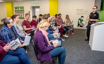 A group of adults learning health and safety basics