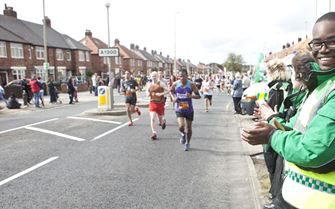 St John Ambulance first aiders cheer on runners at event